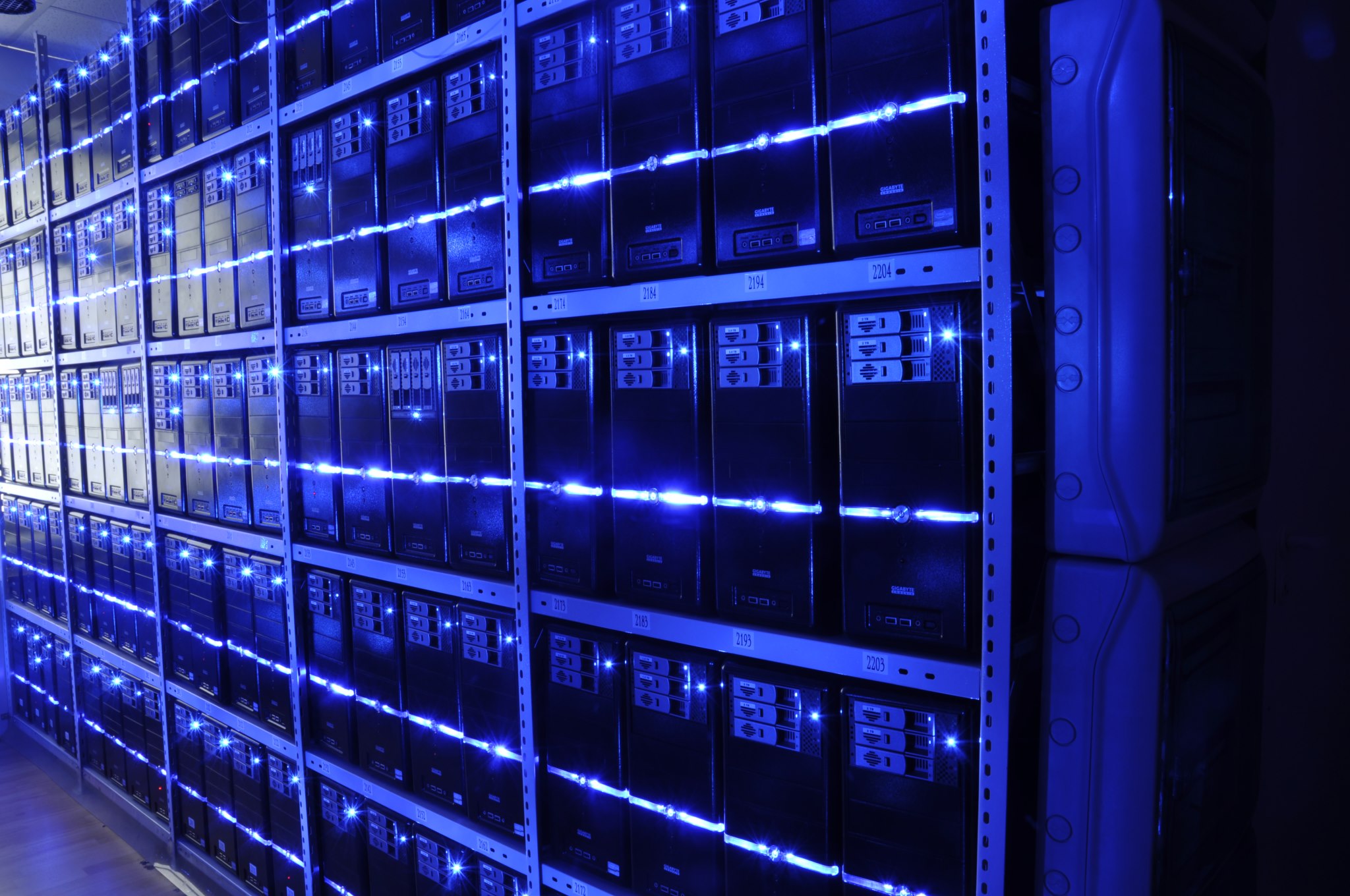 Rows of server racks in a working data centre.